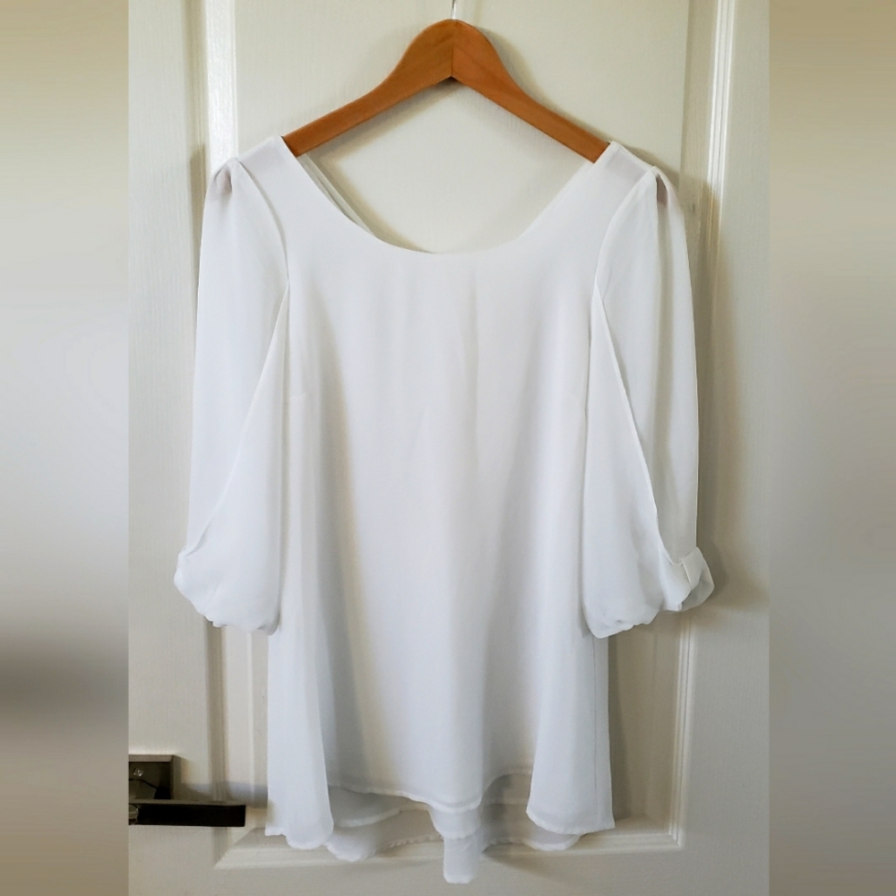 Excellent used condition Naked Zebra 3/4 sleeve white blouse, size S